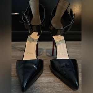 Christian Louboutin Black Patent Leather Pointed-Toe Ankle-Strap Pumps.